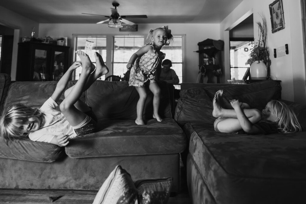 young siblings playing on a couch, from a lifestyle session in Atlanta